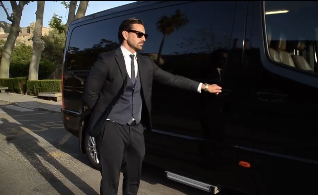 Luxury Mercedes chauffeur service at hotel entrance